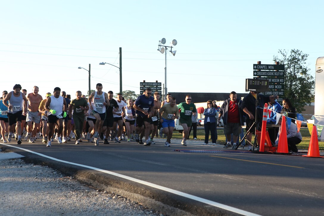 Runners cross the starting line during the Marine Corps Community Services’ Beirut Memorial 10K race aboard Camp Johnson, Oct. 9.  Service members, families, retired military personnel, civilians and children participated in the 6.2-mile race in honor of those who lost their lives in the Beirut bombings on Oct. 23, 1983.