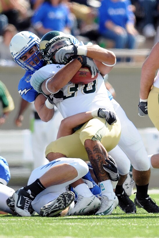 Air Force defensive linemen tackle CSU fullback Zac Pauga during the teams' game at Falcon Stadium Oct 9, 2010. CSU, which came in averaging 56 rushing yards per game, racked up nearly 300 yards on the ground against the Falcons. (Air Force photo/Rachael Boettcher)
