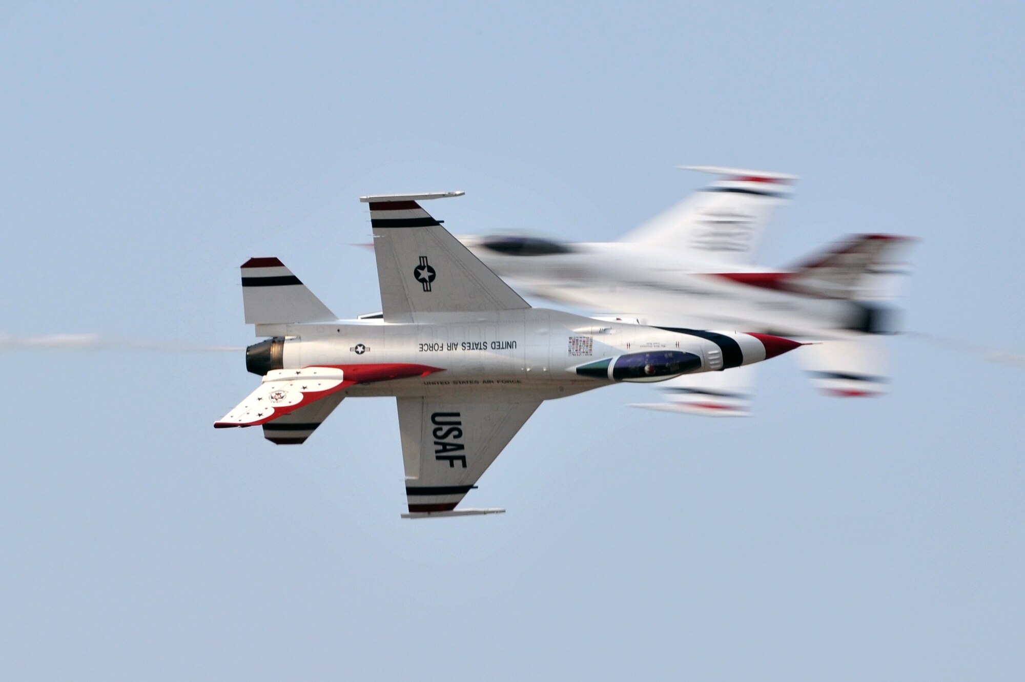Member of the Air Force Thunderbirds F-16 demonstration team soar above Little Rock Air Force Base during the Thunder Over the Rock air show Oct. 9. The demonstration team is one of 18 performers appearing at the two-day event. (U.S. Air Force photo by Staff Sgt. Chris Willis)