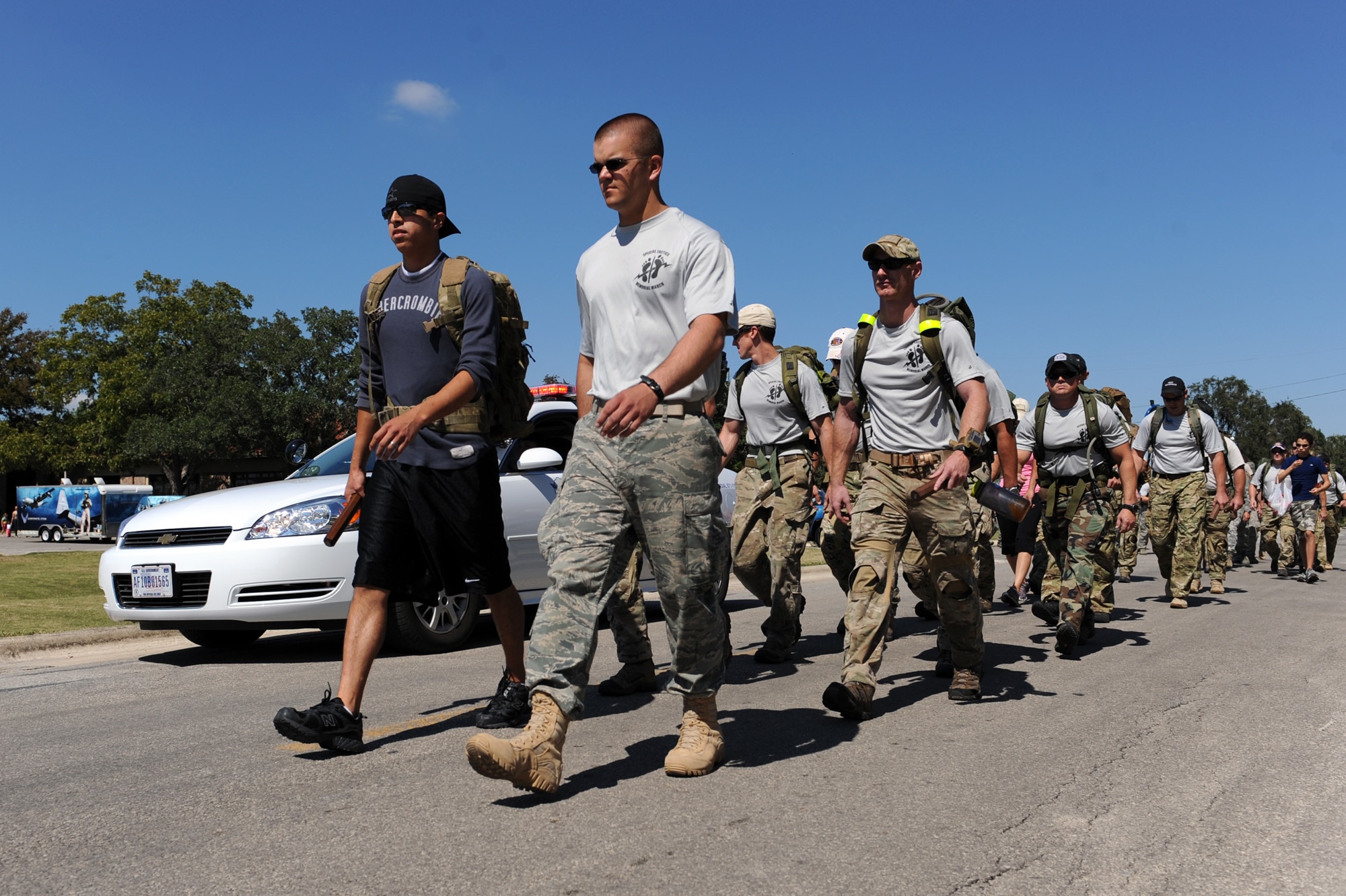 Airmen and family members join 15 Airmen Oct. 9, 2010, who are starting the Tim Davis Special Tactics Memorial March that will take them from Lackland Air Force Base, Texas, to Hurlburt Field, Fla.  They are marching to honor fallen special tactics Airmen and their journey will cover more than 800 miles as they pass through five states. (U.S. Air Force photo/Staff Sgt. Desiree N. Palacios)