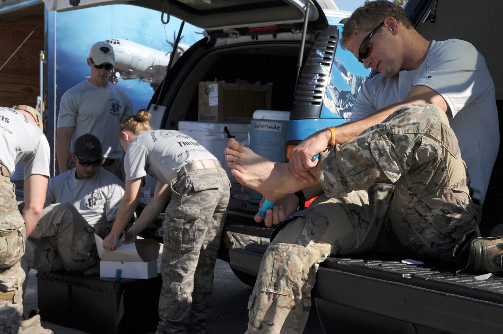 Airmen make last-minute preparations Oct. 9, 2010, just before they begin their journey from Lackland Air Force Base, Texas, to Hurlburt Field, Fla.  They are a part of a 15-man team that is marching from San Antonio to Hurlburt Field to honor fallen special tactics Airmen. The journey will cover more than 800 miles and five states. (U.S. Air Force photo/Staff Sgt. Desiree N. Palacios)