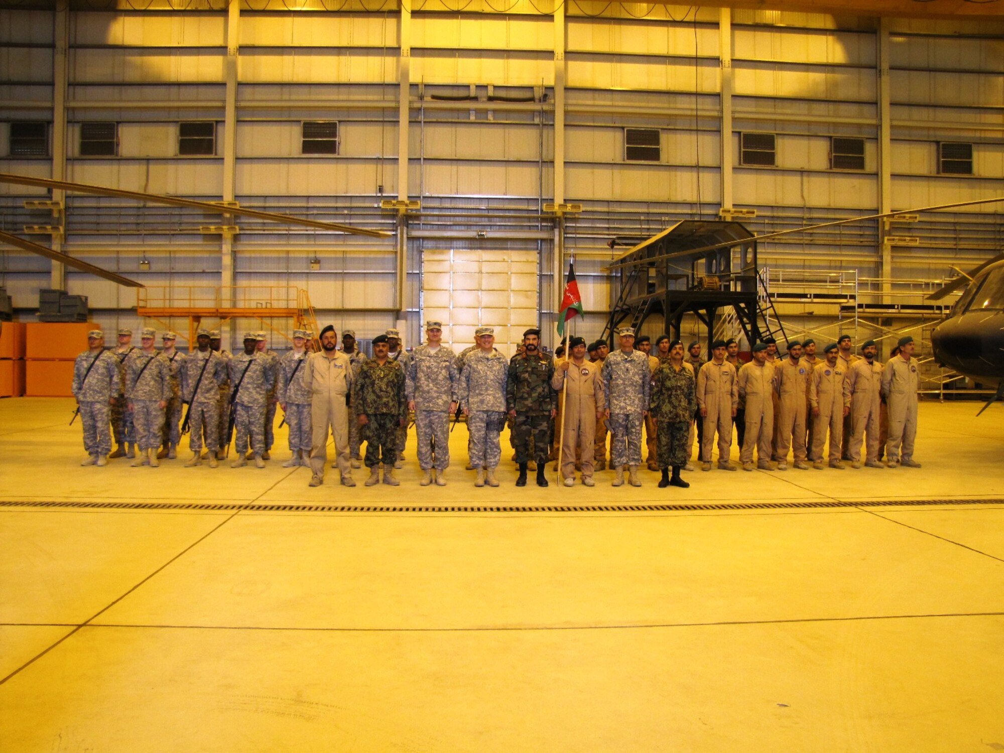 KABUL, Afghanistan - During a transfer ceremony, the Afghan Air Force took the responsibility of the Afghan Crew Chief & Air Assault Academy from the 3rd Combat Aviation Brigade on Oct 9, 2010. (U.S. Air Force photo by Capt. Rob Leese/RELEASED).