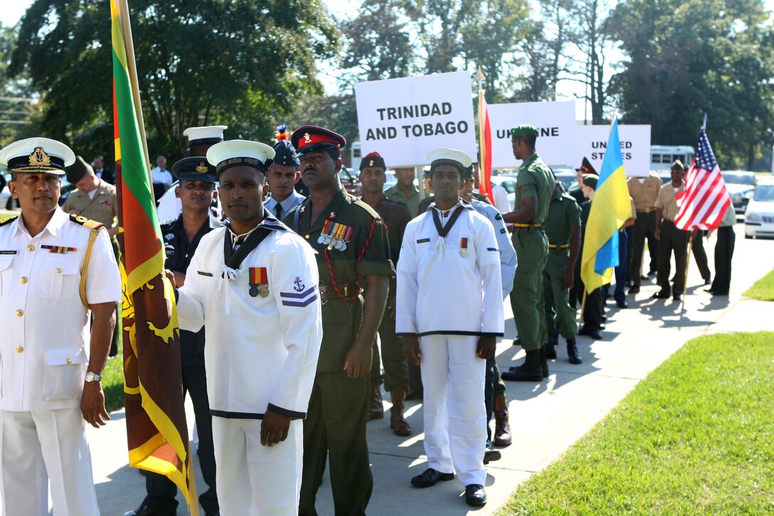 Service members from Sri Lanka stand in formation, ready to march on their national colors before the opening ceremonies of the 53rd World Military Boxing Championships, hosted aboard Marine Corps Base Camp Lejeune, Oct. 10. The ceremony was the beginning of a six day competition to showcase the different cultures and skill of boxers from 14 different countries including Barbados, Estonia, Sri Lanka, Brazil and the Republic of Guinea.