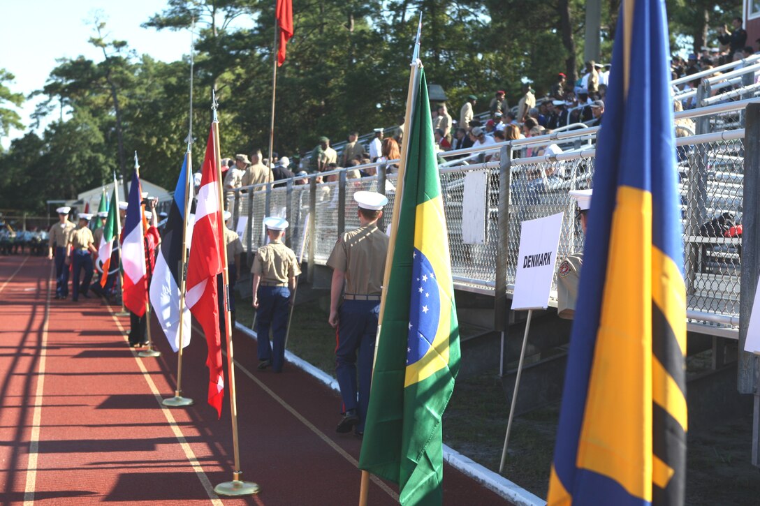 Military athletes from around the world and children in the Young Marines program maneuver to their seats after the opening ceremonies of the 53rd World Military Boxing Championships, hosted aboard Marine Corps Base Camp Lejeune, Oct. 10. The ceremony was the beginning of a six day competition to showcase the different cultures and skill of boxers from 14 different countries including Barbados, Estonia, Sri Lanka, Brazil and the Republic of Guinea.