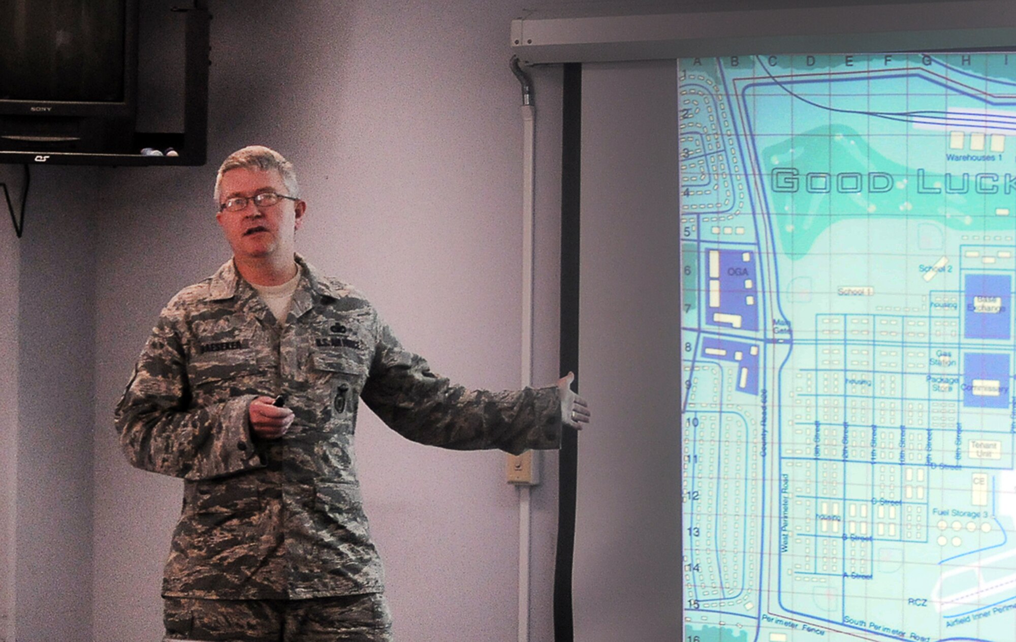 YOKOTA AIR BASE, Japan -- Master Sgt. Eric Haeseker, 374th Security Forces manager security forces directorate, briefs course attendees on the current terrorist threat during a mock terrorist protection exercise, here Oct. 1. More than 40 military and civilian personnel were in attendance during an Anti-Terrorism training seminar. (U.S. Air Force Photo/ Airman 1st Class Katrina R. Menchaca)