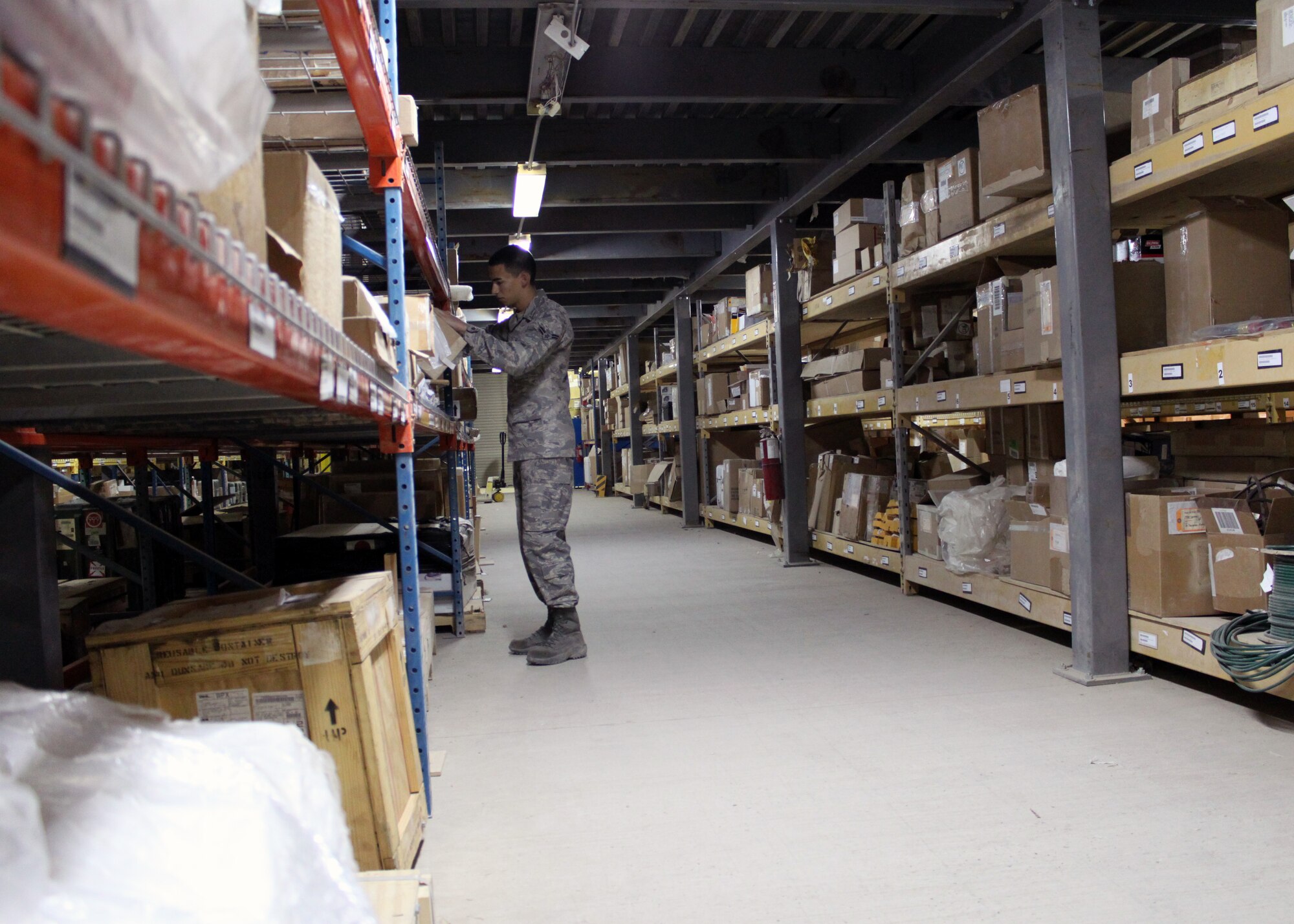 Airman 1st Class Jason Huynh, 332nd Expeditionary Logistics Readiness Squadron Material Management material management technician, inventories stored supplies in the 332 ELRS Supply warehouse Oct. 1, 2010, Joint Base Balad, Iraq.  The 332 ELRS Material Management Flight did a thorough review of everything under their control and was able to redistribute more than 3,000 line items no longer used or rarely used to help reduce the size of the Supply footprint on Balad. Airman Huynh is a native of San Jose, Calif., deployed from Barksdale Air Force Base, Calif. (U.S. Air Force photo/Tech. Sgt. Stacy Fowler)