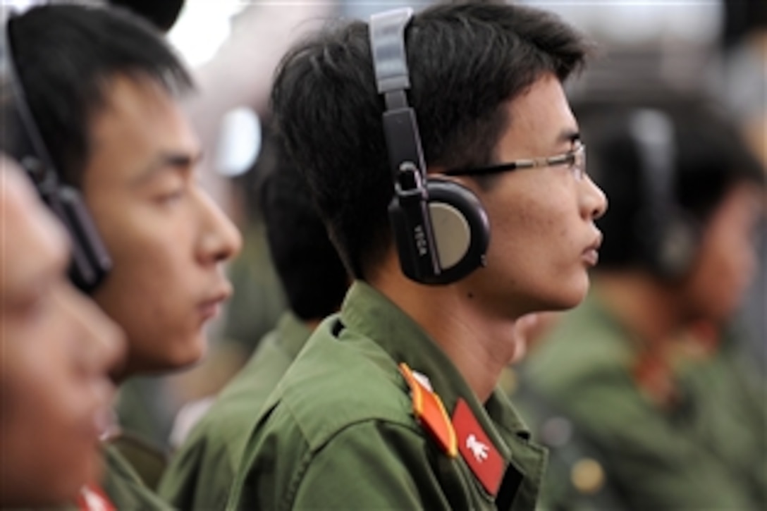 Vietnamese military members listen to U.S. Defense Secretary Robert M. Gates as he speaks at Vietnam National University in Hanoi, Vietnam, Oct. 11, 2010. 