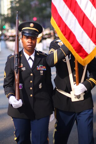 NEW YORK -- Army Staff Sgt. Petrina Williams, from New York City Recruiting Battalion and a Queens, N.Y., native, marches as a member of a joint service color guard in the annual Columbus Day Parade, here, Oct. 11. The parade organizers estimated more than 100 bands, floats and contingents marched in the annual parade and nearly one million spectators watched the procession. (Official Marine Corps photo by Sgt. Randall A. Clinton / RELEASED)