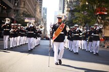 Gunnery Sgt. Victor Miranda, 2nd Marine Aircraft Wing Band drum major and a New York native, marches the band up 5th Ave during the annual Columbus Day Parade, here, Oct. 11. The parade organizers estimated more than 100 bands, floats and contingents marched in the annual parade and nearly one million spectators watched the procession.