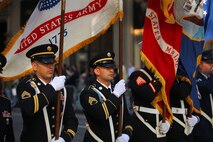 NEW YORK -- Army Staff Sgt. Issac Frutos(left) , from New York City Recruiting Battalion and a Ventura, Calif., native and Army Staff Sgt. Juan Manuel Marias (center), from New York City Recruiting Battalion and a Albuquerque, N.M native, marches as members of a joint service color guard in the annual Columbus Day Parade, here, Oct. 11. The parade organizers estimated more than 100 bands, floats and contingents marched in the annual parade and nearly one million spectators watched the procession. (Official Marine Corps photo by Sgt. Randall A. Clinton / RELEASED)