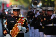 NEW YORK -- Gunnery Sgt. Victor Miranda, 2nd Marine Aircraft Wing Band drum major and a New York native, marches the band up 5th Ave during the annual Columbus Day Parade, here, Oct. 11. The parade organizers estimated more than 100 bands, floats and contingents marched in the annual parade and nearly one million spectators watched the procession. (Official Marine Corps photo by Sgt. Randall A. Clinton / RELEASED)