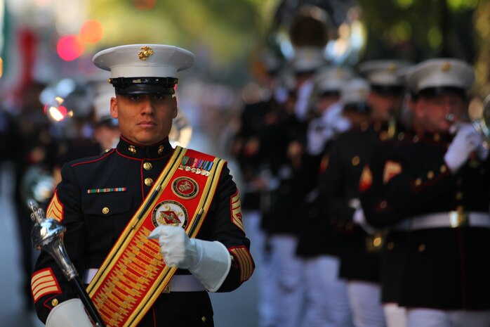NEW YORK -- Gunnery Sgt. Victor Miranda, 2nd Marine Aircraft Wing Band drum major and a New York native, marches the band up 5th Ave during the annual Columbus Day Parade, here, Oct. 11. The parade organizers estimated more than 100 bands, floats and contingents marched in the annual parade and nearly one million spectators watched the procession. (Official Marine Corps photo by Sgt. Randall A. Clinton / RELEASED)