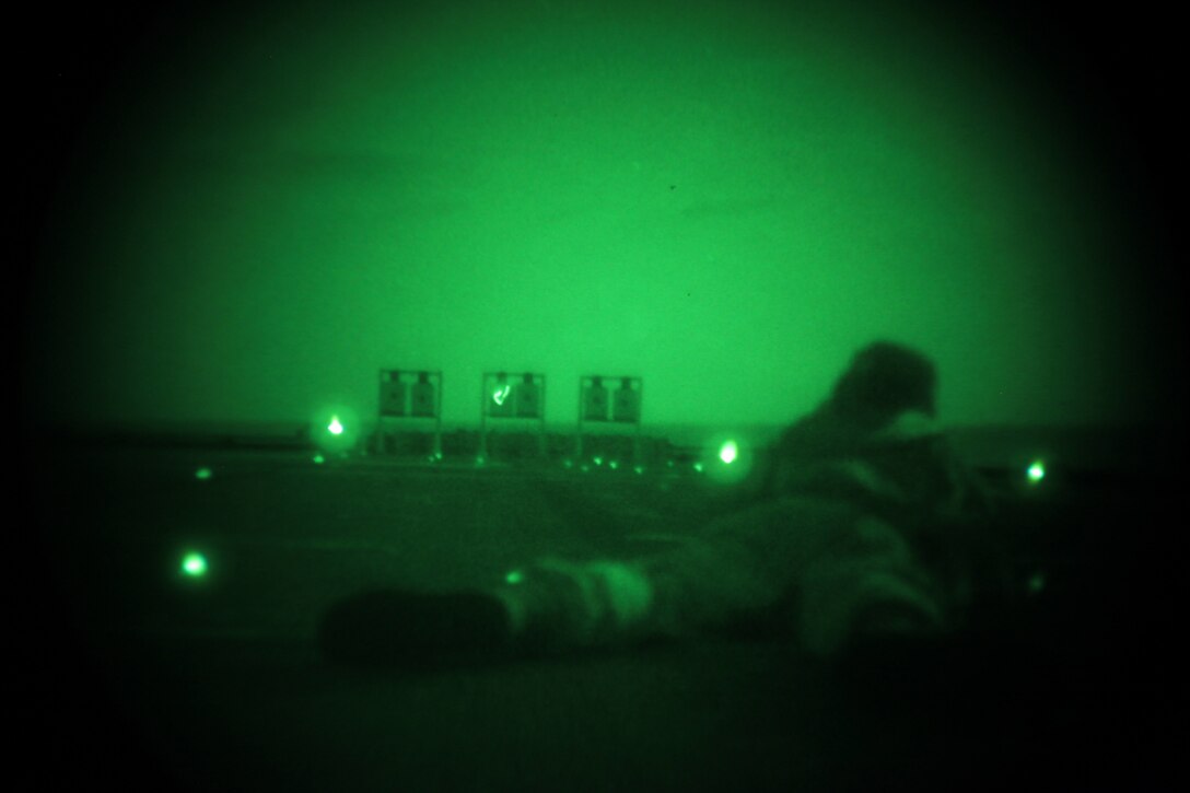 Major Michael Monroe, the executive officer of  Combat Logistics Battalion 26, 26th Marine Expeditionary Unit, fires an M4 service rifle during a night live-fire event aboard USS Ponce in the U.S. Navy Fifth Fleet Area of Responsibility, Oct. 12, 2010. 26th Marine Expeditionary Unit continues to support relief operations in Pakistan and is also serving as the U.S. Central Command theater reserve force as elements of the MEU conduct training and planned exercises.