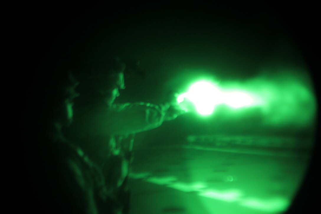 Sergeant Anthony Tripp, a military policeman with Military Police Detachment, Combat Logistics Battalion 26, 26th Marine Expeditionary Unit, fires a M9 9mm pistol during a night live-fire training aboard USS Ponce in the U.S. Navy Fifth Fleet Area of Responsibility, Oct. 12, 2010. 26th Marine Expeditionary Unit continues to support relief operations in Pakistan and is also serving as the U.S. Central Command theater reserve force as elements of the MEU conduct training and planned exercises.