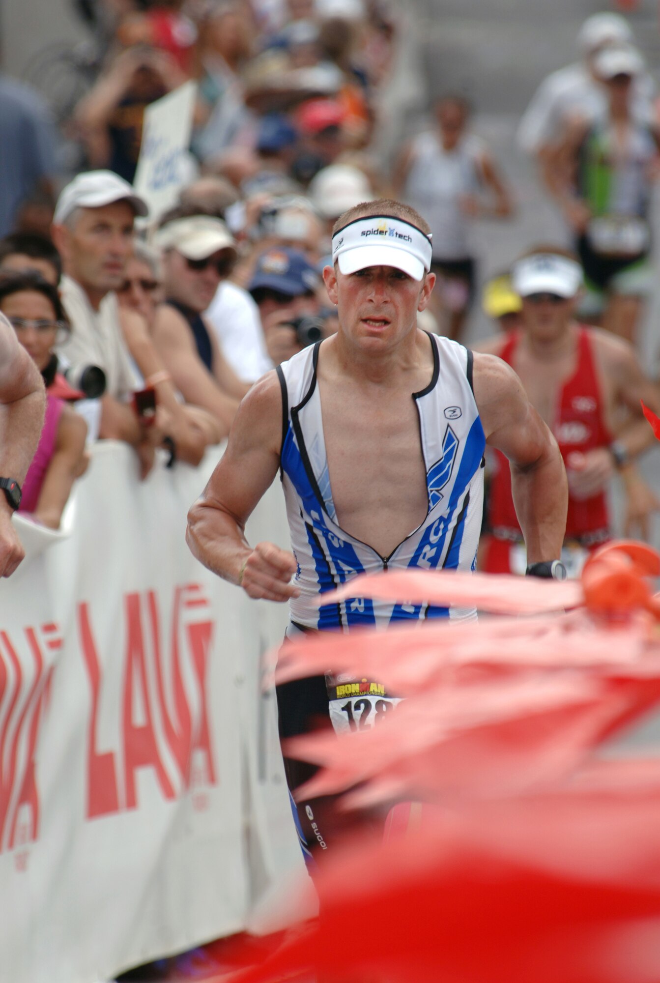 Scott Poteet, the Cadet Squadron 02 air officer commanding, sets off on the 26.2 mile run portion of the Ironman World Championship Saturday, Oct. 9, 2010 in Kailua-Kona, Hawaii.  Poteet was selected to represent the Air Force in this year's competition.  It was the second time he competed in the world championship race in Kona.  (U.S. Air Force photo/Staff Sgt. Raymond Hoy)