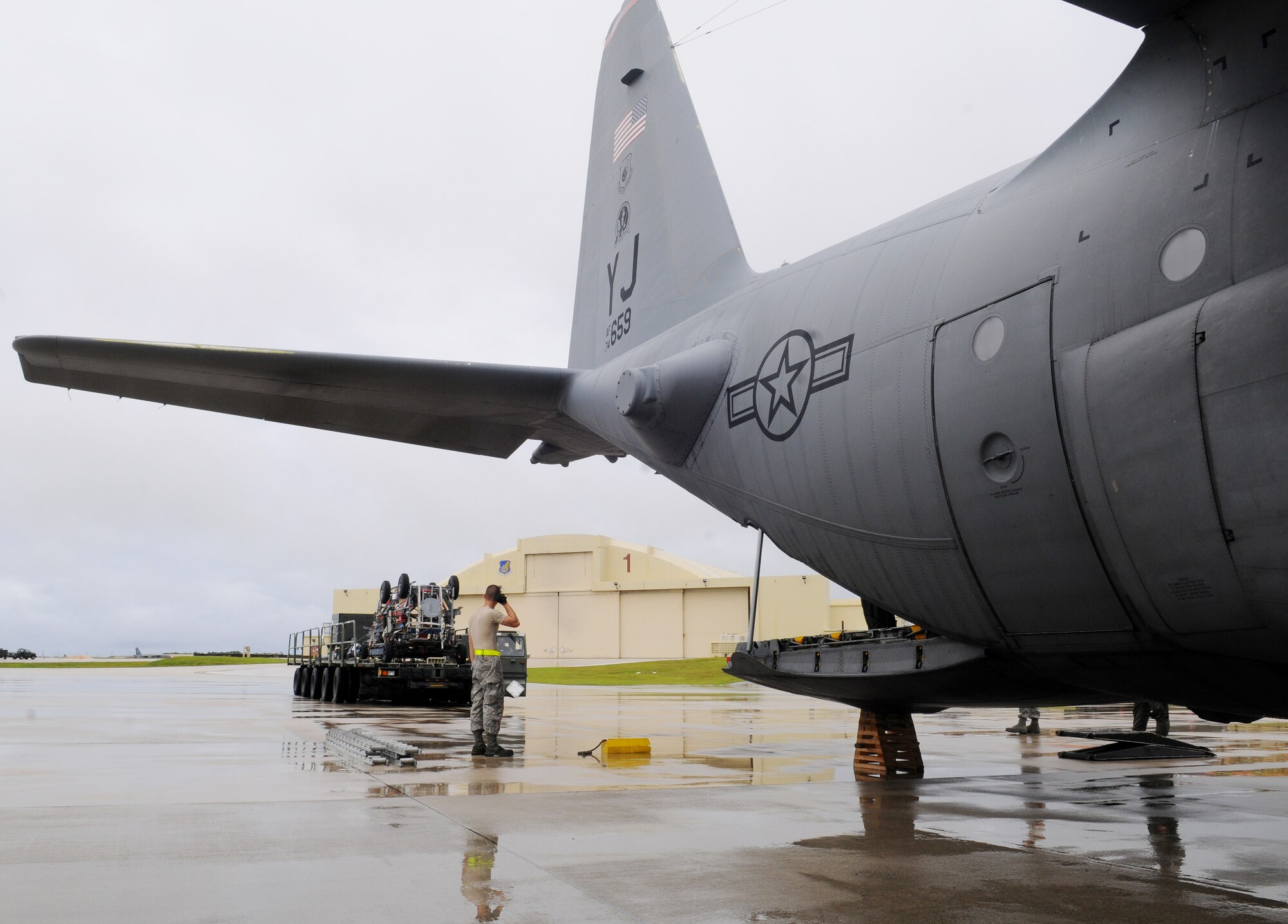 Staff Sgt. Allen Rees, 734th Air Mobility Squadron aerial porters loads essential equipment used for Valiant Shield on a C-130 Hercules at Andersen Air Force Base, Guam, Sept. 30. The 734th AMS successfully supported Pacific Commands largest exercise, Valiant Shield 2010, while simultaneously executing fighter and tanker unit swap outs and sustained normal Air Mobility Command missions. (U.S. Air Force photo/Senior Airman Nichelle Anderson)