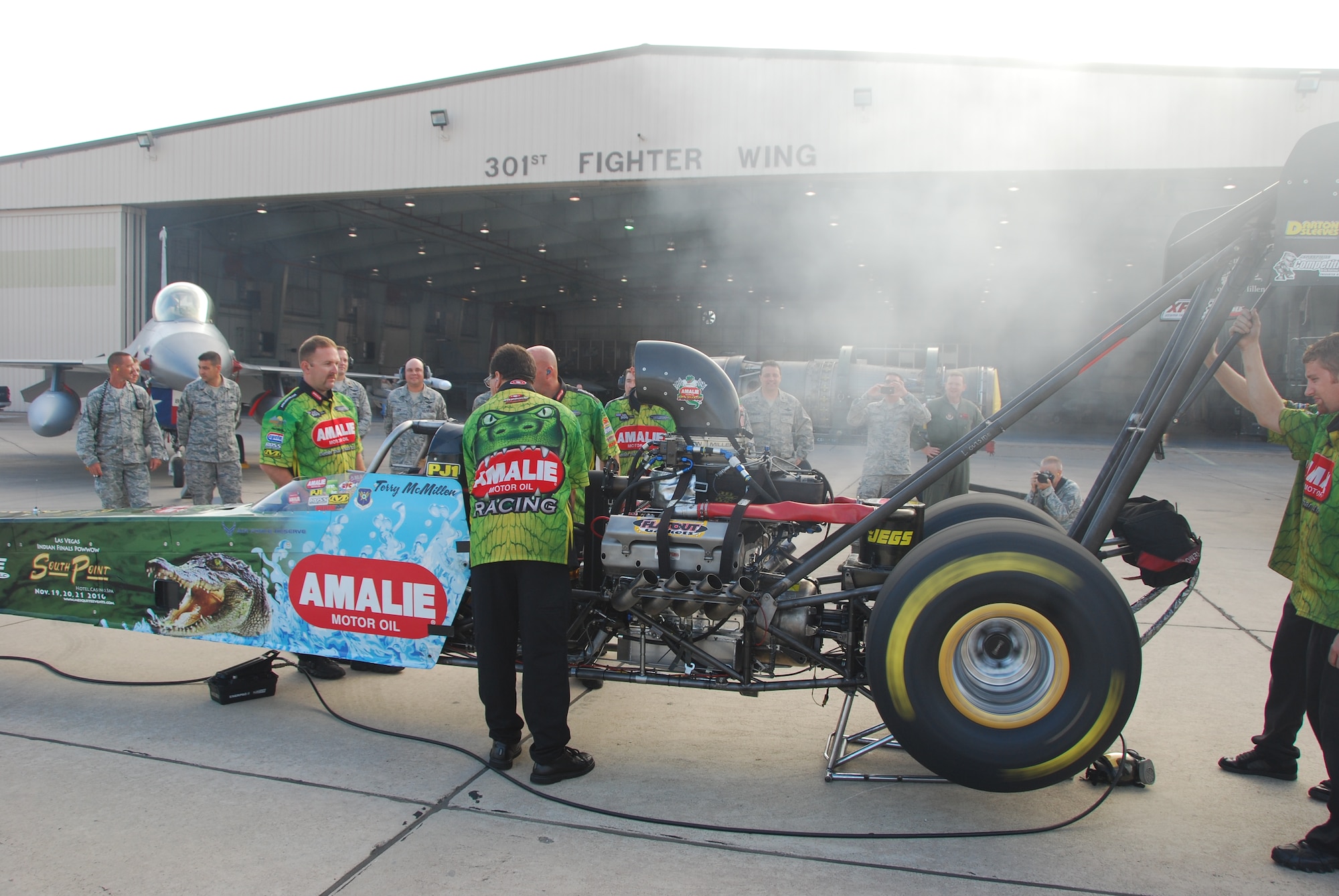Mr. Terry McMillen, driver of the Amalie Oil Top Fuel dragster, fires up his car.  McMillen and his crew recently visited the 301st Fighter Wing before racing at a Dallas-area event. (Air Force Photo/Tech. Sgt. Shawn McCowan)