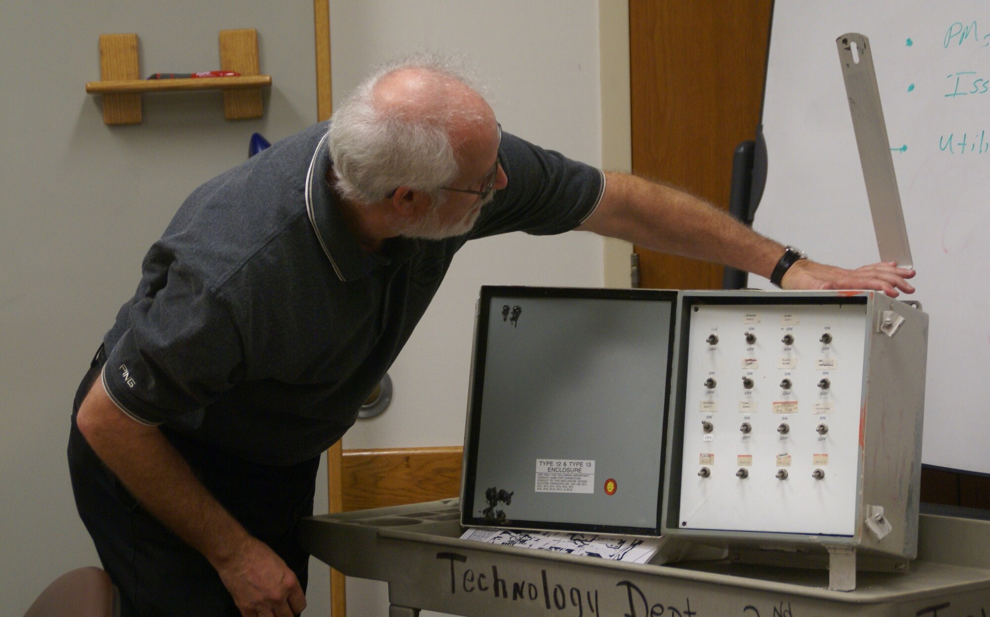 Dr. Ralph Jones displays one of the original “Johnson Junctions,” which allowed AEDC terminals to access the main computer without making every office a “closed area.” (Photo by: Andrea Stephens)