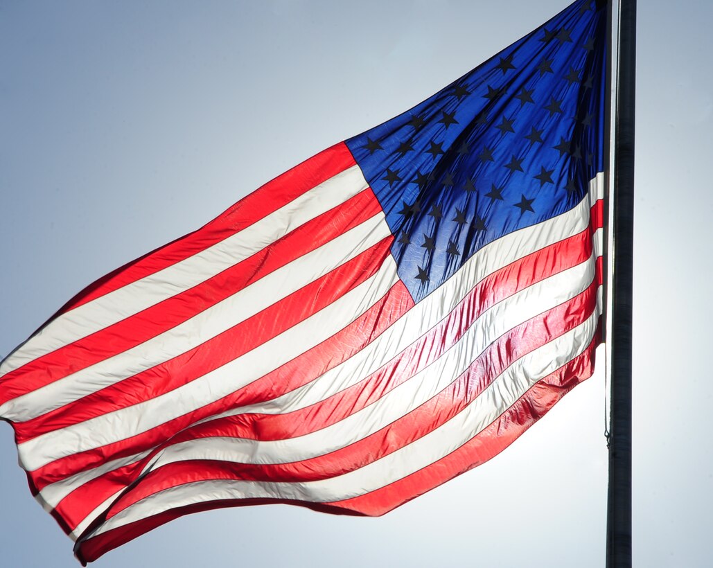 ELLSWORTH AIR FORCE BASE, S.D. -- The base flag flies high before being lowered during the Prisoner of War/Missing in Action retreat ceremony, Oct. 1.  Ellsworth Airmen spent the day in remembrance of all those who were or still are POW/MIA. (U.S. Air Force photo/Airman 1st Class Anthony Sanchelli)
