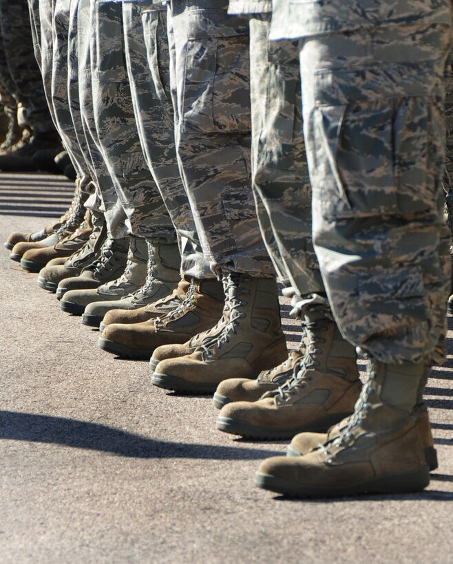 ELLSWORTH AIR FORCE BASE, S.D. -- 28th Bomb Wing Airmen stand in formation and salute the American flag during the prisoner of War/Missing in Action retreat ceremony, Oct. 1.  As part of POW/MIA day, Airmen participated in two events prior to the retreat ceremony, a 5k run and a motorcycle ride to the Black Hills National Cemetery. (U.S. Air Force photo/Airman 1st Class Anthony Sanchelli)
