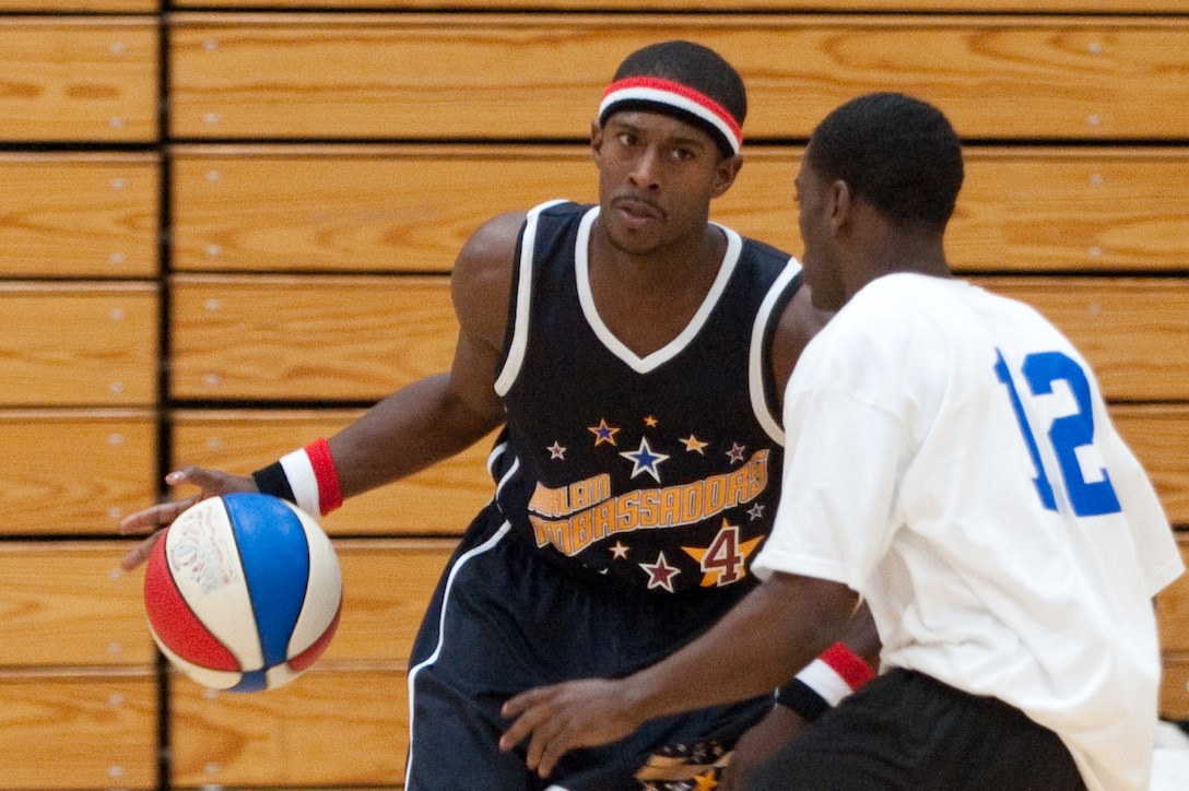 ELLSWORTH AIR FORCE BASE, S.D. -- Jesse Whintly of the Harlem Ambassadors faces off against Jerel Guyton of the Ellsworth All Stars during a basketball show held at the Bellamy Fitness Center Oct. 8. The Harlem Ambassadors are a professional basketball show geared towards family and promoting positive values like staying in school, fostering racial harmony and staying off drugs. (U.S. Air Force photo/Tech. Sgt. Nathan Gallahan)
