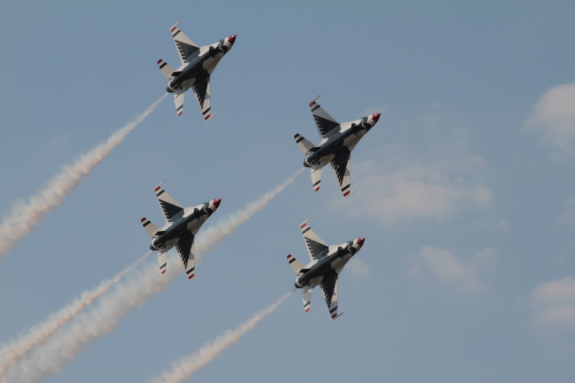 The Air Force Thunderbirds fly in a diamond formation over Little Rock Air Force Base Oct. 10 during the air show and open house.  The flight demonstration exhibited choreographed maneuvers of skills possessed by all Air Force aviators. (U.S. Army photo by Spc. Jared Sollars)