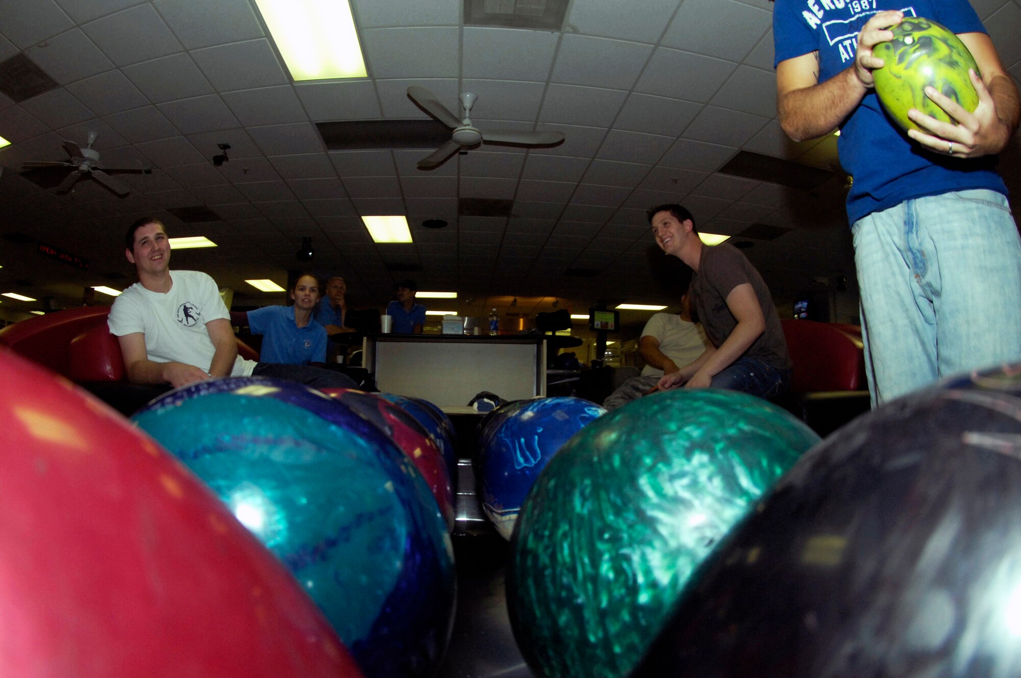 WHITEMAN AIR FORCE BASE, Mo. - Members of the 509th Force Support Squadron Bowling Center team and the 509th Bomb Wing team await their turn to bowl Oct. 5 during the first Squadron Bowling Center Challenge. If a challenging squadron beats the Bowling Center representatives, each member of the team receives a voucher for a free medium pizza from the Bowling Center. (U.S. Air Force photo/Senior Airman Jason Barebo)