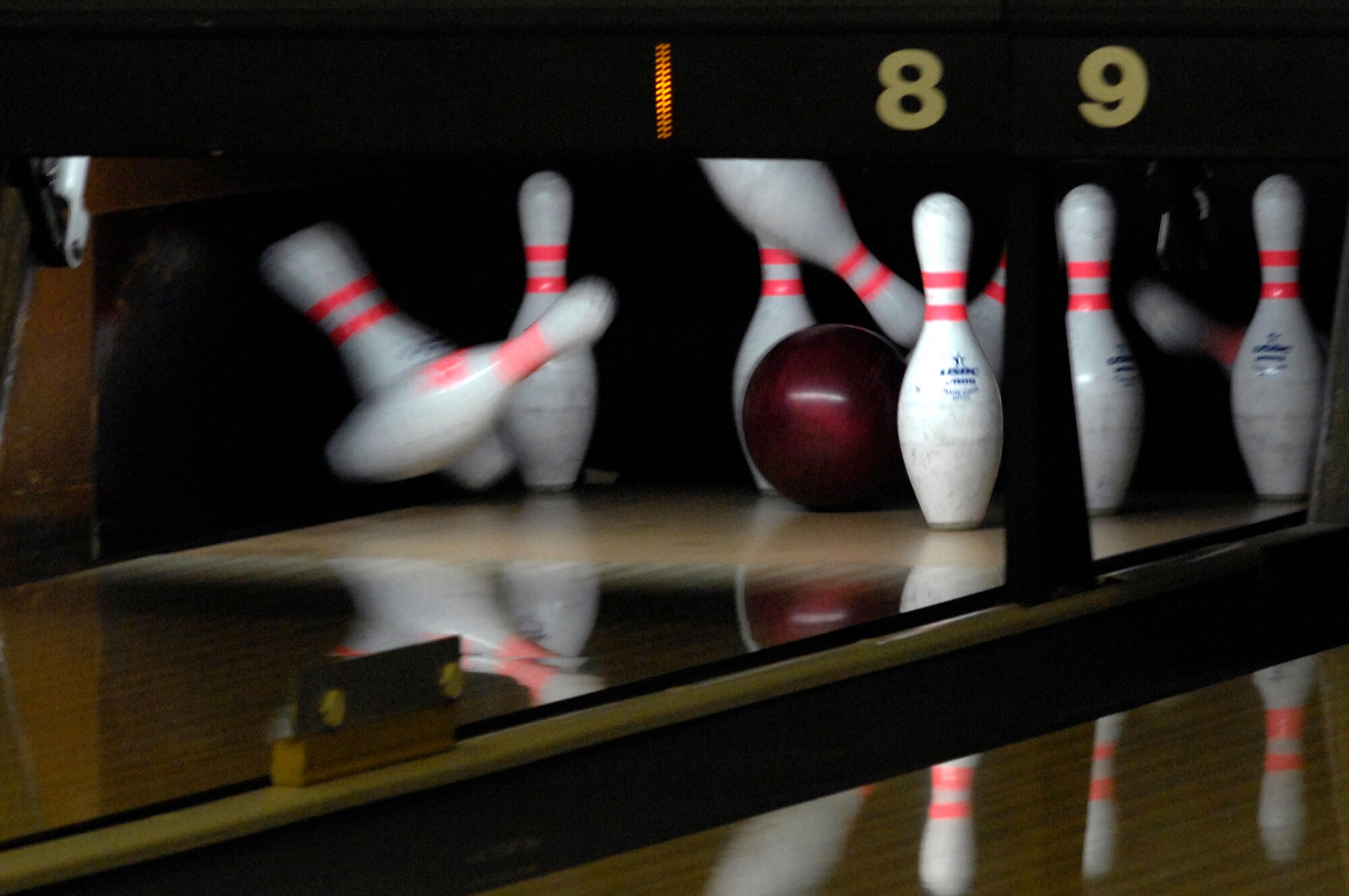 WHITEMAN AIR FORCE BASE, Mo. - A bowling ball strikes bowling pins at the Whiteman Bowling Center Oct. 5, leaving a 7 - 10 split. The Bowling Center is open Monday 7 a.m. - 2 p.m., Tuesday through Thursday 7 a.m. - 9 p.m., Friday 7 a.m. - 11 p.m., Saturday 9 a.m. - 11 p.m. and Sunday noon - 9 p.m. (U.S. Air Force photo/Senior Airman Jason Barebo)