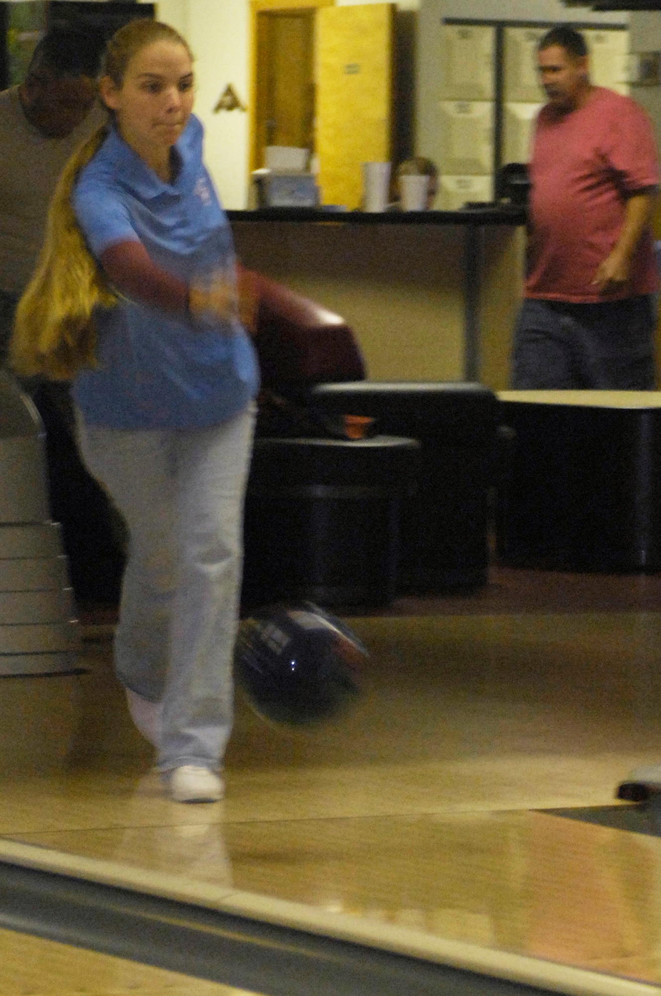 WHITEMAN AIR FORCE BASE, Mo. - Vicki Williams, Bowling Center cashier, throws her ball down the alley during the first Squadron Bowling Center Challenge Oct. 5. against four members of the 509th Bomb Wing Staff and 509th Comptroller Squadron. Ms. Williams bowled a 117 for the first game and a 106 the second game. (U.S. Air Force photo/Senior Airman Jason Barebo)