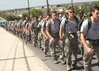 Airmen and family members join 15 Airmen Oct. 9 as they march in honor of fallen special tactics Airmen. The 860-mile march will take the Airmen from the Lackland Training Annex to Hurlburt Field, Fla. (U.S. Air Force photo/Robbin Cresswell) 

