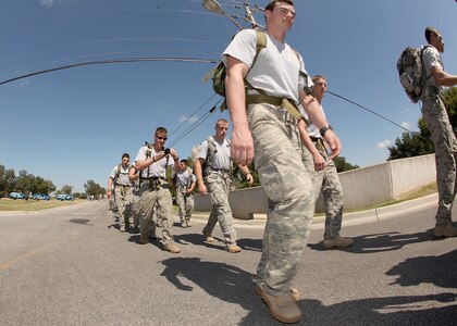 Airmen and family members join 15 Airmen Oct. 9 as they march in honor of fallen special tactics Airmen. The 860-mile march will take the Airmen from the Lackland Training Annex to Hurlburt Field, Fla. (U.S. Air Force photo/Robbin Cresswell)