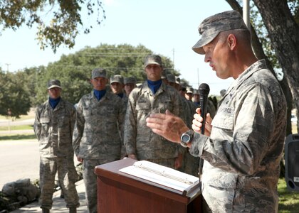 Col. William H. Mott V speaks during an opening ceremony of the Walk for the Fallen at Lackland's Training Annex Oct. 9. Colonel Mott is the 37th Training Wing commander. (U.S. Air Force photo/Robbin Cresswell)