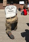 An Airman says a prayer before the start of the Walk for the Fallen Oct. 9. Also called the Tim Davis Special Tactics Memorial March, the 860-mile trek will stretch across five states and will consist of six teams walking 24 hours a day, in a relay format. (U.S. Air Force photo/Robbin Cresswell)
 