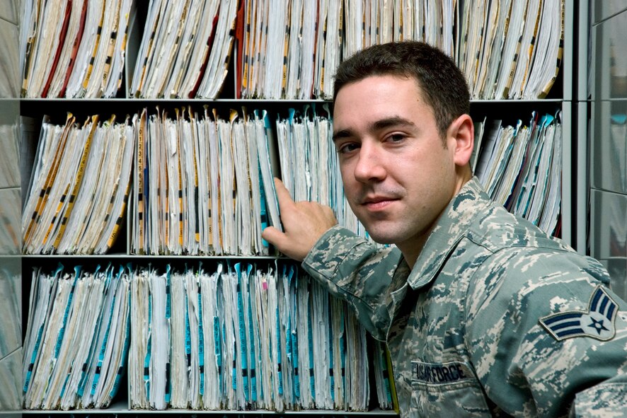 Senior Airman Justin Grenon, a records manager at the 439th Aerospace Medicine Squadron, pulls medical records inside the Air Base Clinic at Westover.  Airman Grenon has been working in records management for a year and a half and says it can be tedious and never-ending, but he takes pride in the work he does.  "I like helping others and I work with some great people," he said.