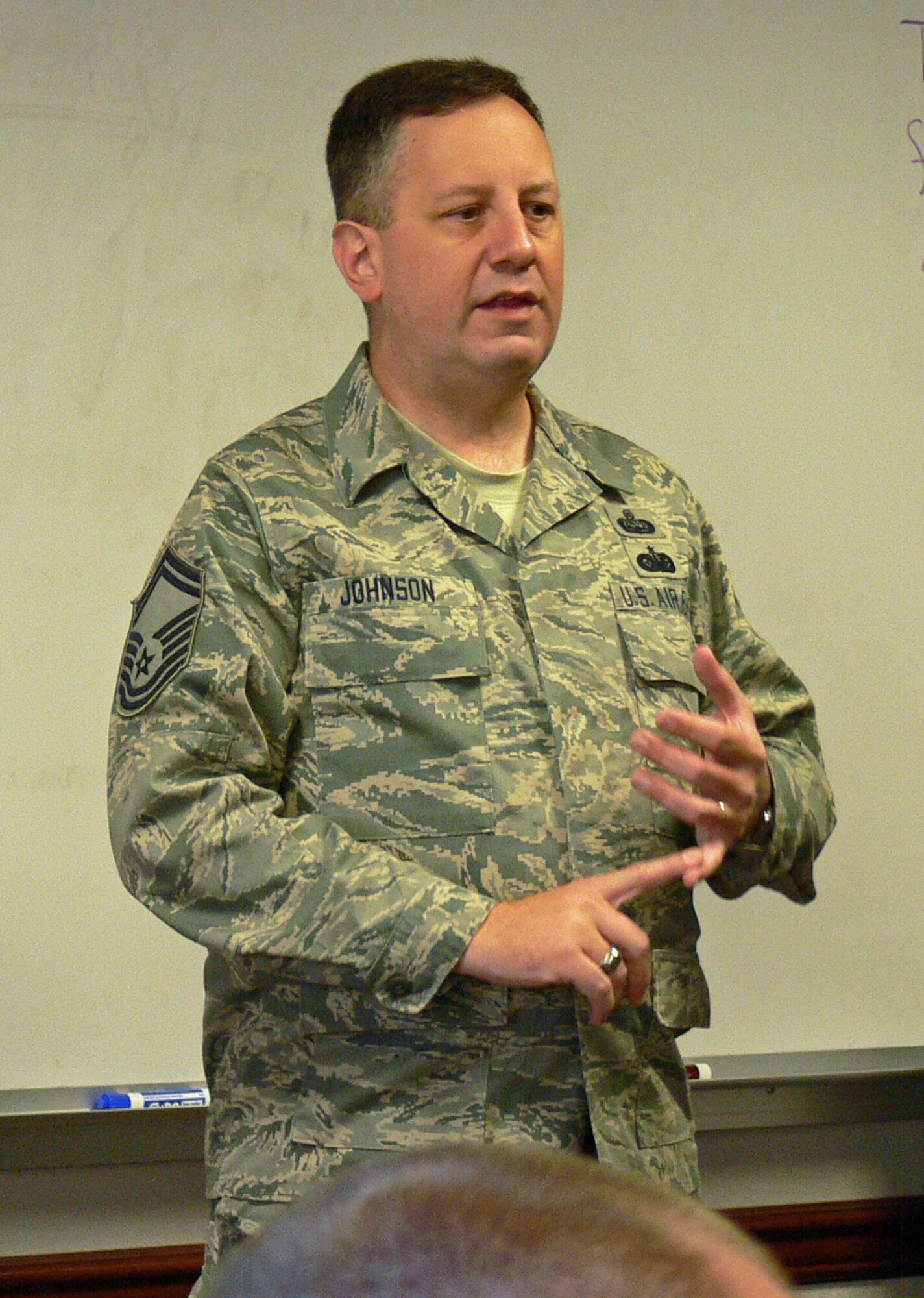 Senior Master Sgt. Clayton Johnson, a volunteer Bystander Intervention Training facilitator, discusses the statistics of sexual violence with a BIT class Oct. 7 on Peterson Air Force Base. BIT is a 90-minute course designed to get Airmen thinking about what they could do if they witnessed a sexual assault or how they might prevent an assault. The training is mandatory for all Airmen and Department of Defense civilian employees and replaces the annual sexual assault prevention and response training. To date, about half of all Airmen and DoD civilians on Peterson have completed the course. (U.S. Air Force photo/Monica Mendoza) 