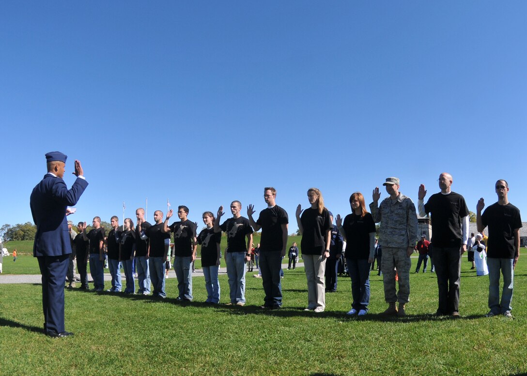 Lt. Col. Kelvin McElroy of the 914th Airlift Wing administers the oath to new 914th reserve members during a mass enlistment at Old Fort Niagara October 9, 2010 Youngstown NY. 
The ceremony took place on a historic battlefield with the Niagara Falls Air Reserve Station honor guard providing the presentation of colors. (U.S. Air Force photo by Staff Sgt. Joseph McKee)
