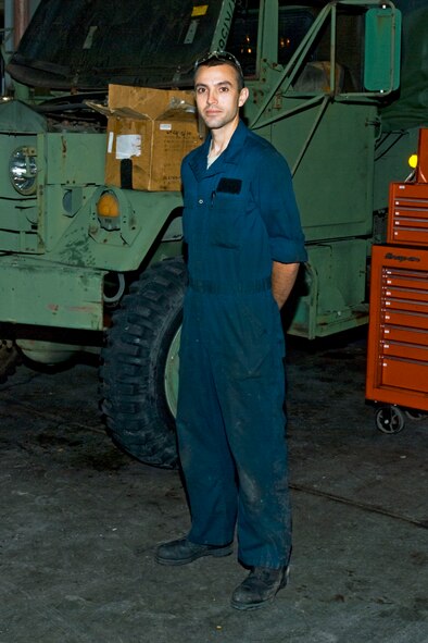 Staff Sgt. Joshua Gallien, a 439th Logistics Readiness Squadron vehicle maintainer, stands alongside a truck he repaired Oct. 4.  Sergeant Gallien said the friendships he's formed at Westover are the best part of working here.  "I love working with the military members," he said.  We joke around.  We work hard.  It's great!"