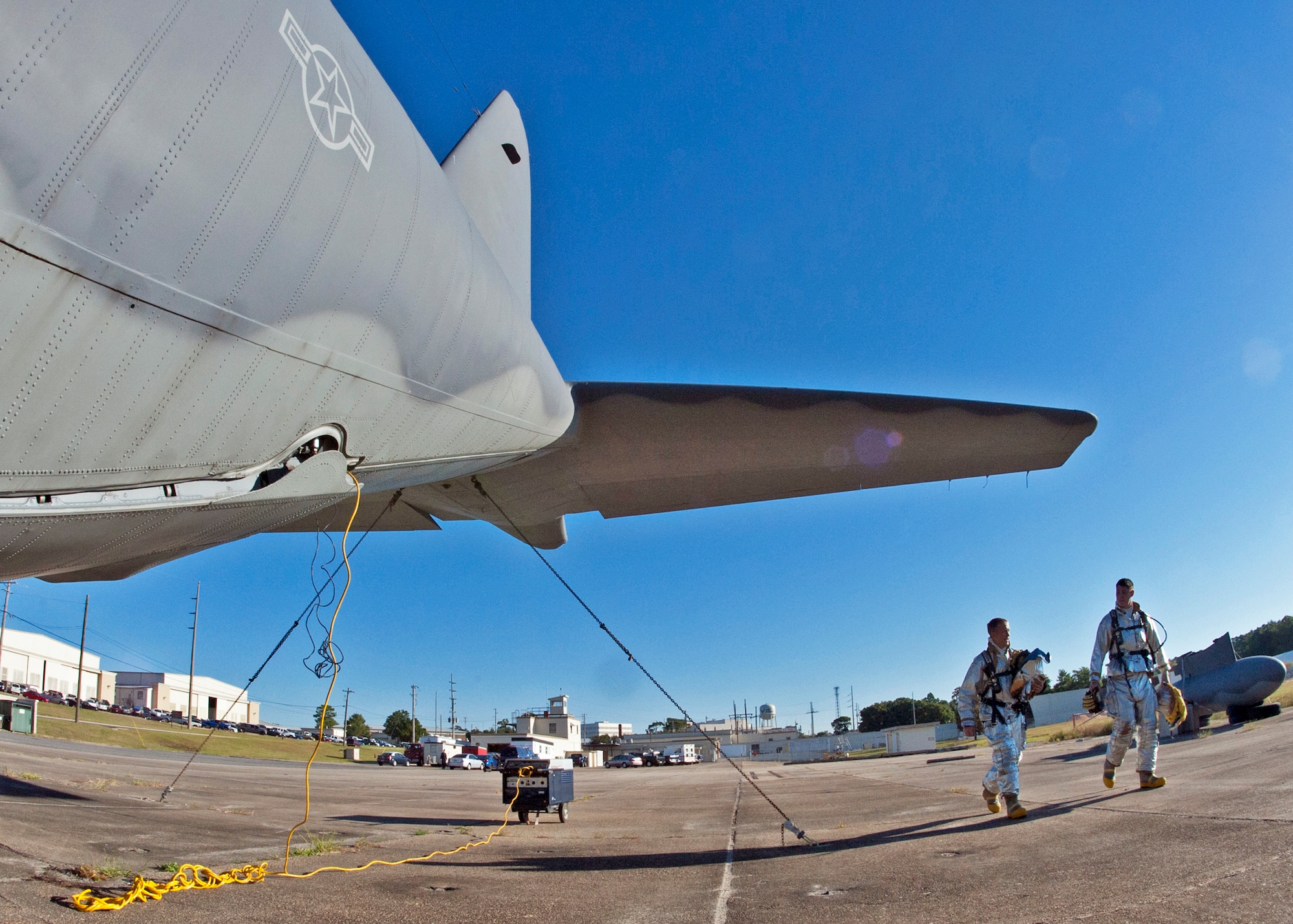 (Left) Maj. David Meissen, 96 Civil Engineer Squadron commander and Senior Airman Nickolas Cox walk to the C-130 before participating in the commanders’ challenge event Oct. 4 at Eglin Air Force Base, Fla.  Base leaders and a partner had to enter the aircraft and find a simulated victim while blindfolded and in fire gear.  The exercise was to demonstrate first-hand what Air Force firefighters experience in the event of a fire.  (U.S. Air Force photo/Samuel King Jr.)