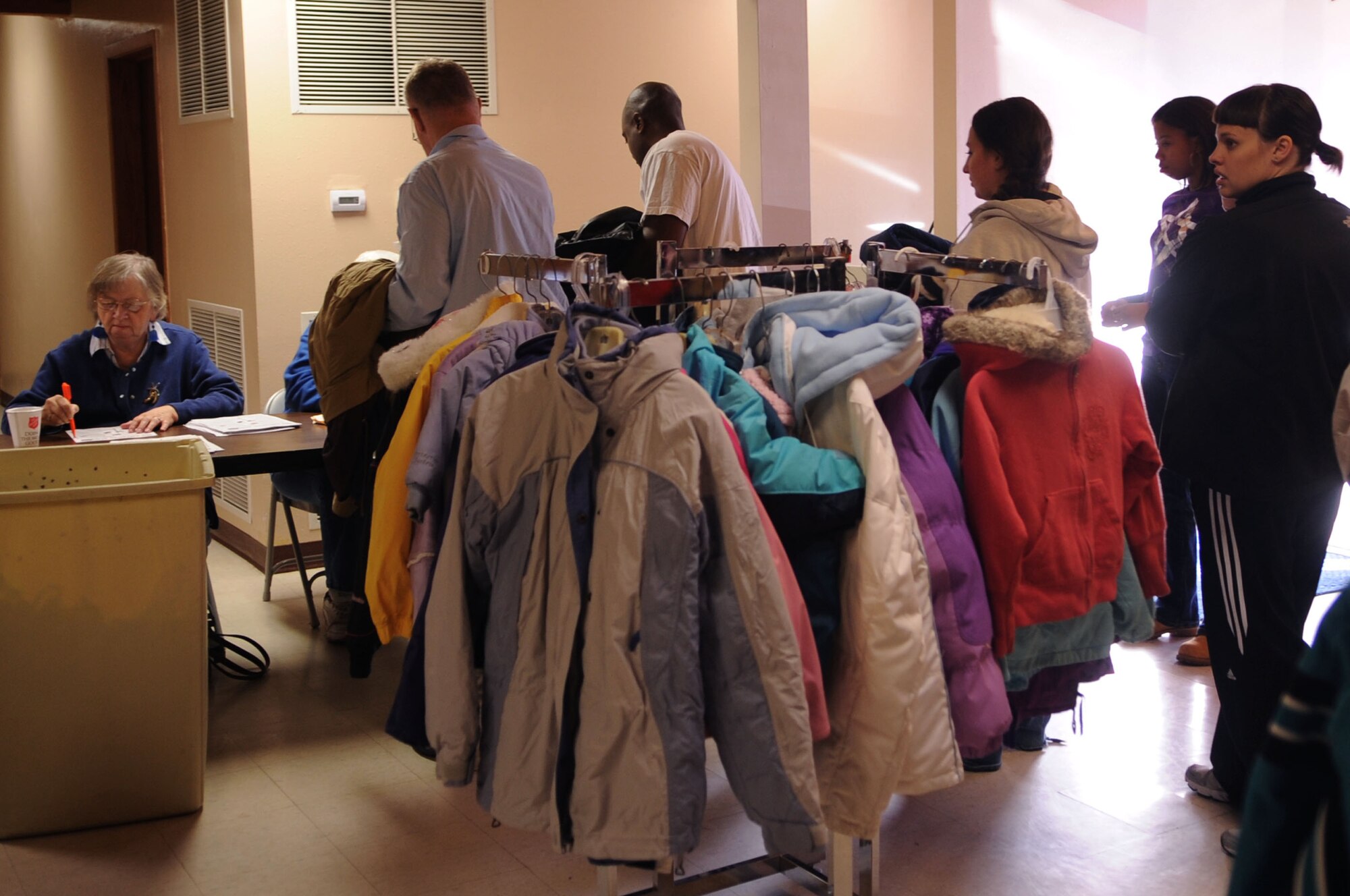 Members from the local community wait in line to check out their newly donated winter clothing items at the Salvation Army’s winter clothing distribution Oct. 6 in Grand Forks, N.D. Volunteers from Grand Forks Air Force Base helped the Salvation Army with set-up, tear-down and handing out winter clothing items.  (U.S. Air Force photo by Senior Airman Amanda N. Stencil)