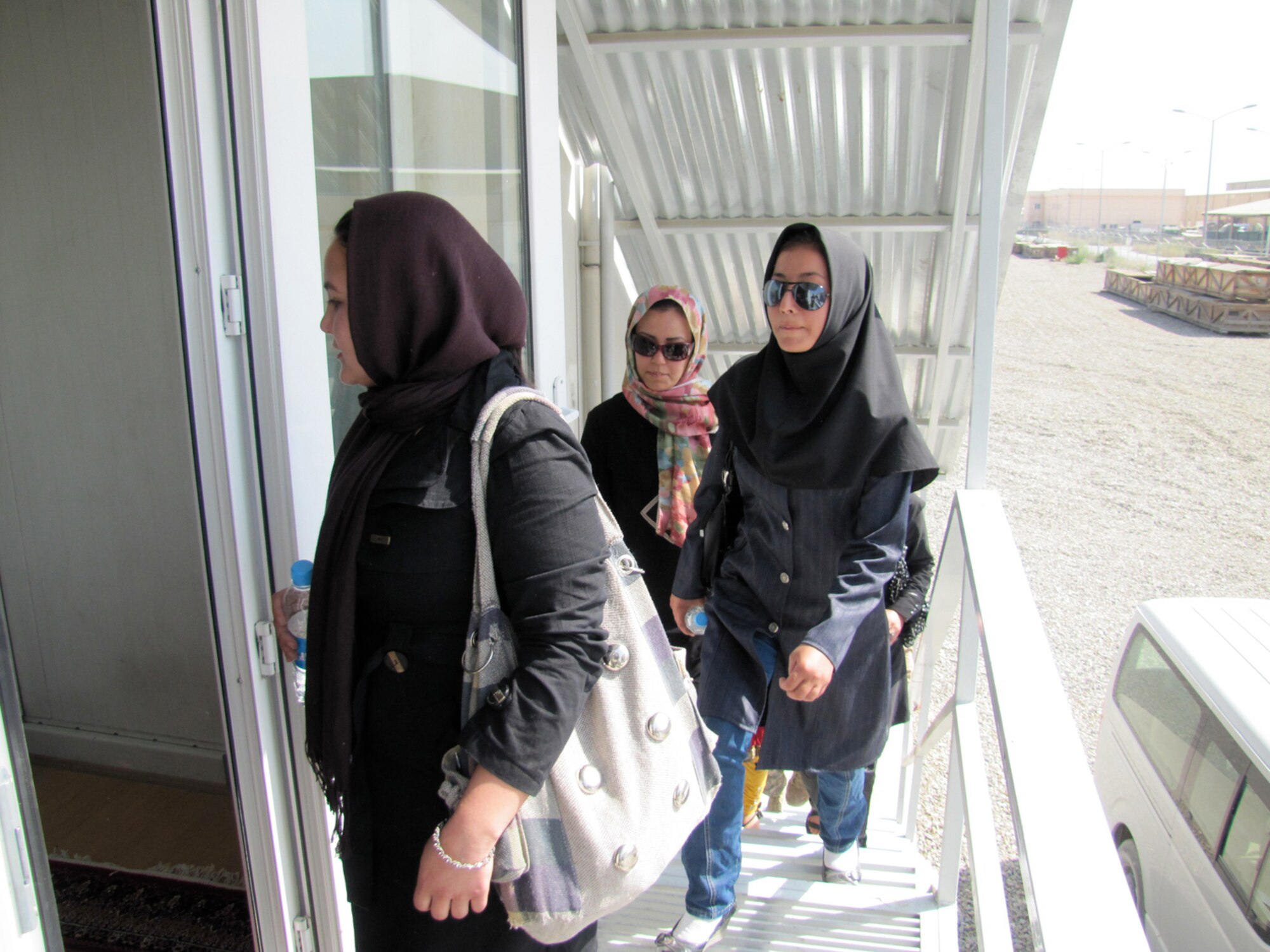 Five newly commissioned female Afghan Lieutenants arrive at the Thunder Lab at the air force base in Kabul on October 12, 2010. (Mass Communications Specialist First Class Elizabeth Burke/RELEASED).