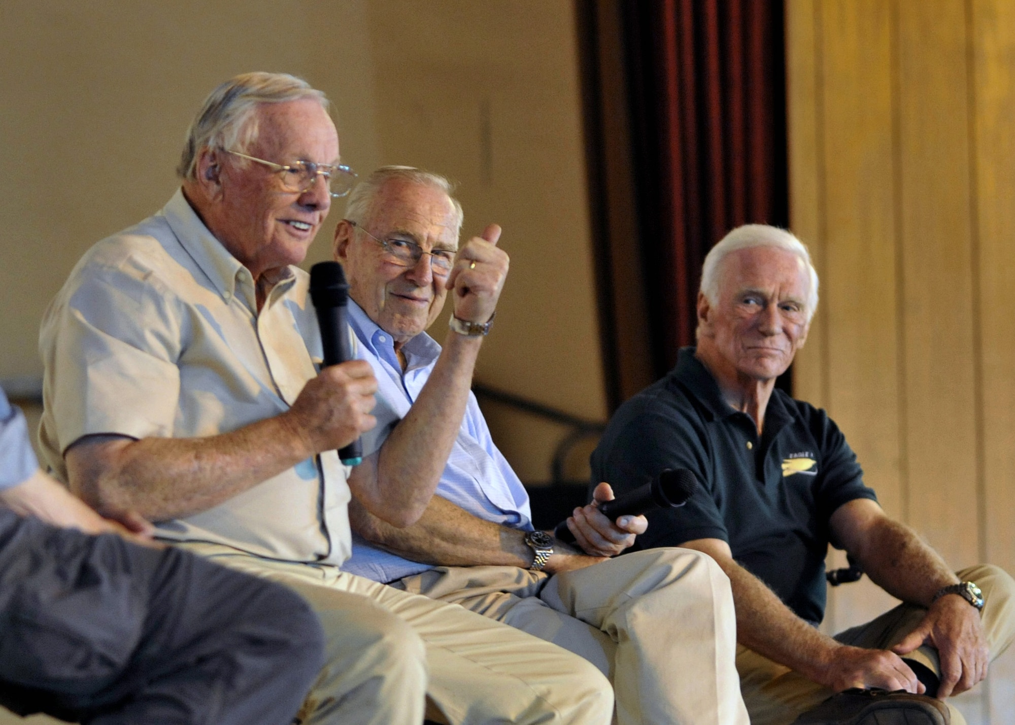 Astronauts Neil Armstrong (left), Jim Lovell and Gene Cernan answer questions during an appearance for 700 service members in the Sustainer Theater, Joint Base Balad, Iraqi, Oct. 11, 2010. During a panel discussion, the spaceflight pioneers shared their groundbreaking aerospace experiences. As Apollo 11 commander, Neil Armstrong was the first human to walk on the moon; retired Navy Capt. Jim Lovell was the commander of the ill-fated Apollo 13 mission; retired Navy Capt. Gene Cernan, Apollo 17 commander, was the last human to depart from the moon. The visit was part of the "Legends of Aerospace Tour," with former "Good Morning America" host David Hartman. Sponsored by the USO and Armed Forces Entertainment, the tour visited bases in Europe and Southwest Asia. (U.S. Air Force photo/Lt. Col. Robert Couse-Baker)