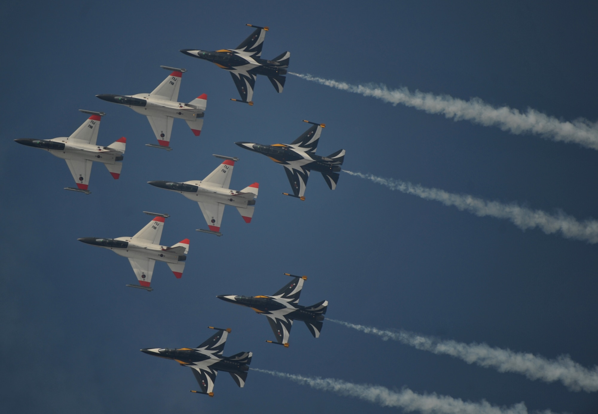 Republic of Korea Air Force Black Eagles TA-50B fighter jets fly over the skies during the 8th Annual Air Power Day at Osan Air Base Oct. 10.  Aerial performances demonstrated the capabilities of the high performance aircraft.  The event included a variety of Korean and American high performance aerial demonstrations, unique ground performances, military equipment static displays, a children's play area and a wide variety of food and souvenir booths. (U.S. Air Force Photo/Senior Airman Evelyn Chavez)