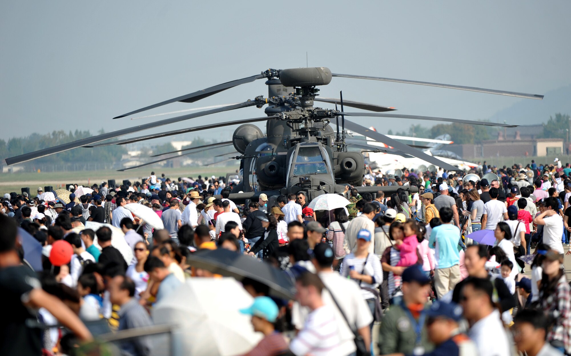 Spectators gather around static displays on Oct. 10 during the 8th Annual Air Power Day 2010 at Osan Air Base.  The event took place Oct. 9 and 10 with aerial demonstrations of the A-10 "Thunderbolt II," F-16 "Fighting Falcon," U-2 "Dragon Lady," the ROKAF TA-50 "Golden Eagle" aircraft. (U.S. Air Force photo/Senior Airman Evelyn Chavez)