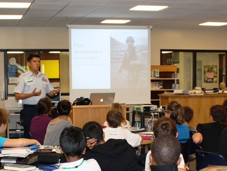 U.S. Air Force Staff Sgt. Samuel Morse, 35th Fighter Wing public affairs NCO in charge of community relations, speaks about his experiences to eighth grade students at Illing Middle School, Manchester, Conn., Sept. 29, 2010. The students were reading Greg Mortenson's book, "Three Cups of Tea," a book about a man's struggles while building schools in Pakistan and Afghanistan. Sergeant Morse talked about the rewards and challenges of living in Japan and Afghanistan, and gave a short journalism workshop for interested students. (Courtesy Photo)