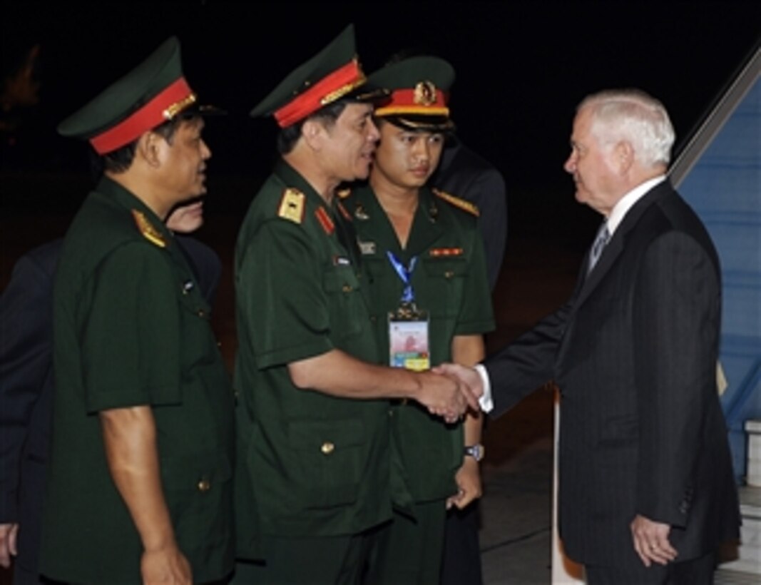 Secretary of Defense Robert M. Gates is welcomed to Hanoi, Vietnam, by Vietnamese Defense officials on Oct. 10, 2010.  