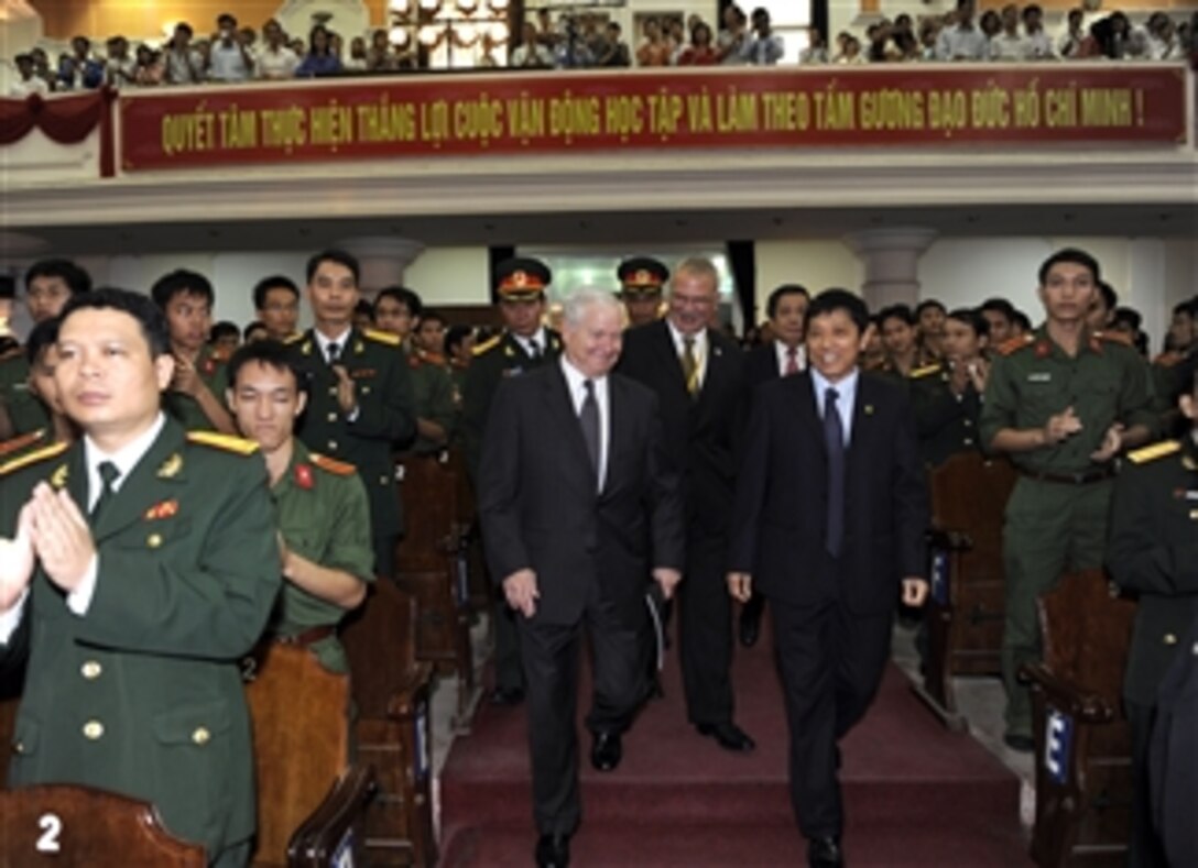Secretary of Defense Robert M. Gates is welcomed to Vietnam's National University by Vietnamese military members, professors and students in Hanoi, Vietnam, on Oct. 11, 2010.  