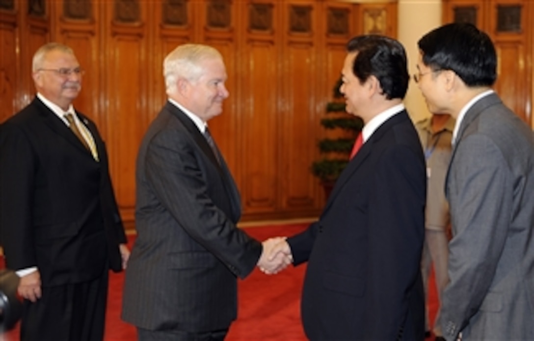 Secretary of Defense Robert M. Gates is greeted by Vietnamese Prime Minister Nguyen Tan Dung in the prime minister?s office in Hanoi, Vietnam, on Oct. 11, 2010.  