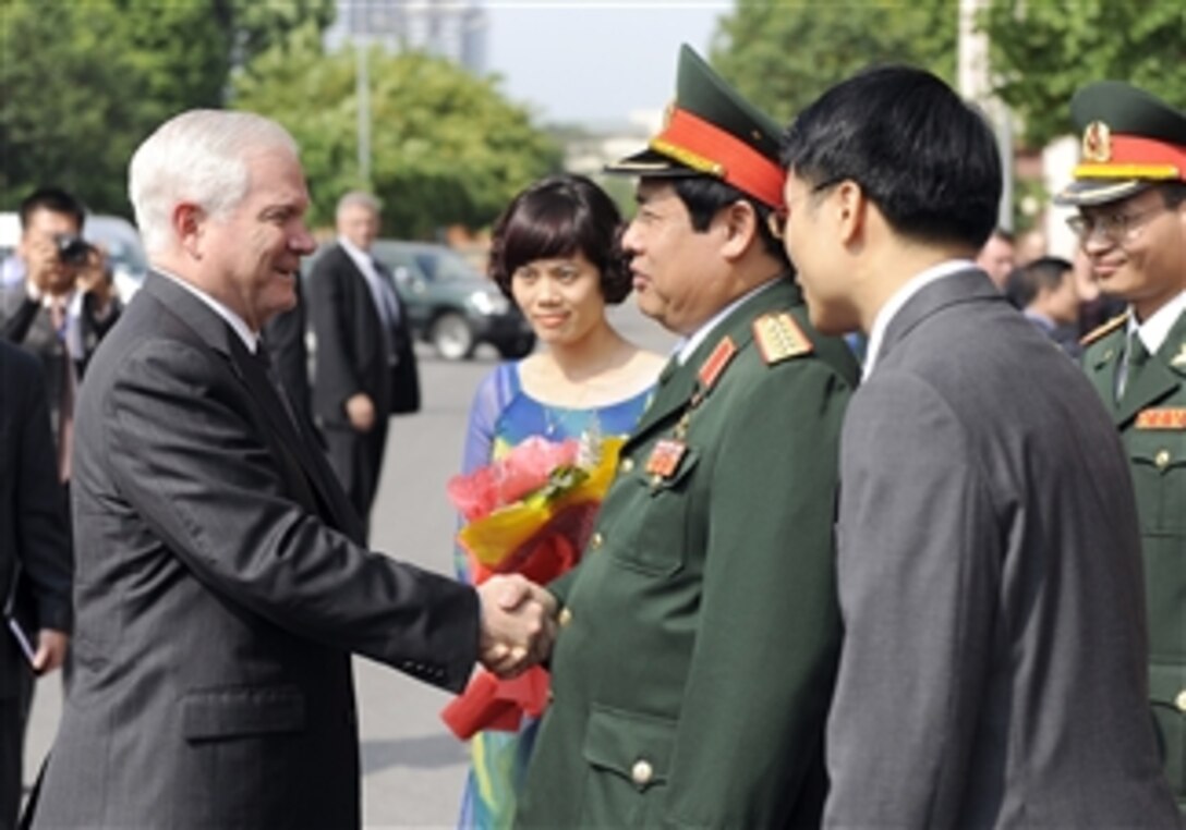 Secretary of Defense Robert M. Gates is greeted by Vietnamese Minister of Defense Gen. Phung Quang Thanh at the Vietnamese Military headquarters in Hanoi, Vietnam, on Oct. 11, 2010.  