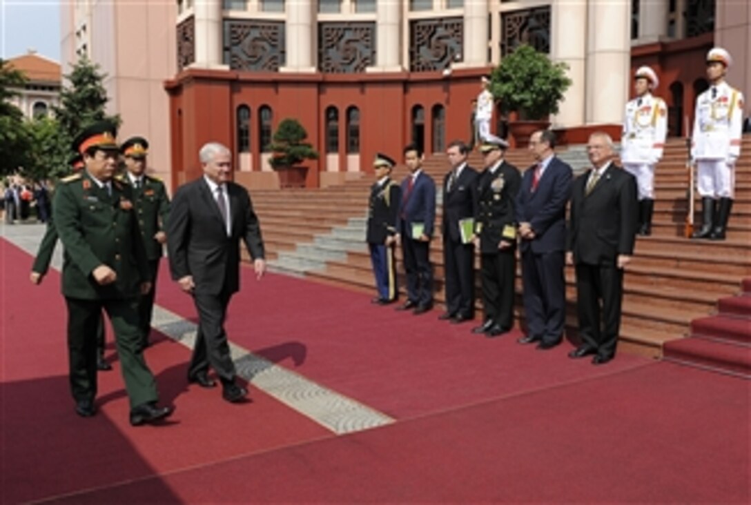 Secretary of Defense Robert M. Gates walks with Vietnamese Minister of Defense Gen. Phung Quang Thanh during a Guards of Honor Ceremony commemorating the official U.S. visit to the Vietnamese Military headquarters in Hanoi, Vietnam, on Oct. 11, 2010.  