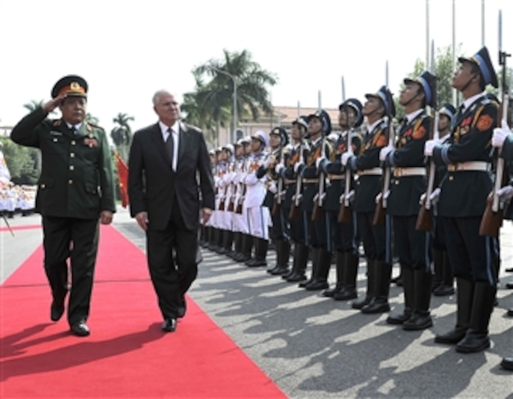Secretary of Defense Robert M. Gates reviews the troops with Vietnamese Minister of Defense Gen. Phung Quang Thanh during a Guards of Honor Ceremony commemorating the official U.S. visit to the Vietnamese Military headquarters in Hanoi, Vietnam, on Oct. 11, 2010.  